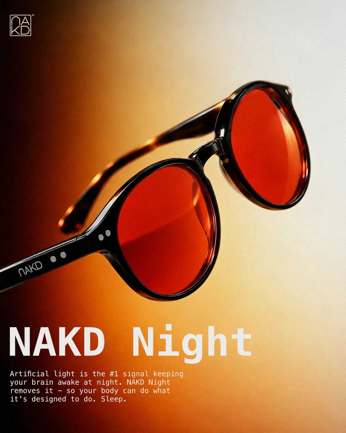 NAKD Night: amber-lens product close-up against warm orange light.