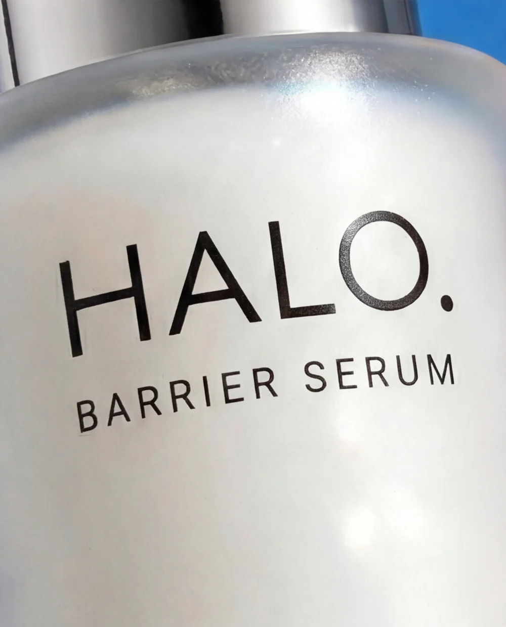 Independent AI-assisted HALO. Barrier Serum study: close-up of the bottle label and pump.