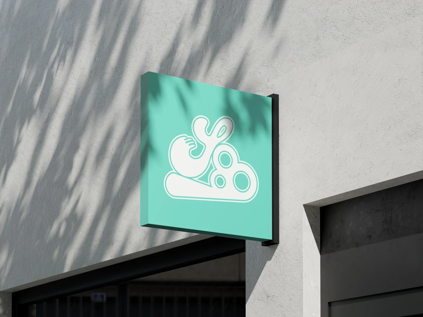 Scoop’s mint identity applied to a projecting shop sign.