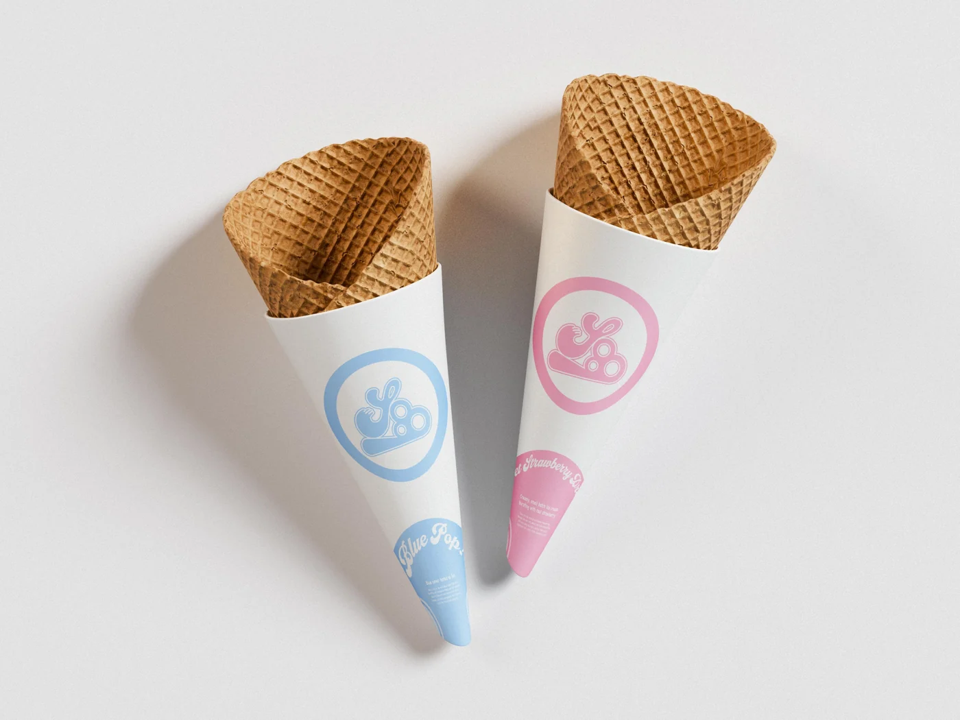 Two waffle cones in white illustrated Scoop sleeves.